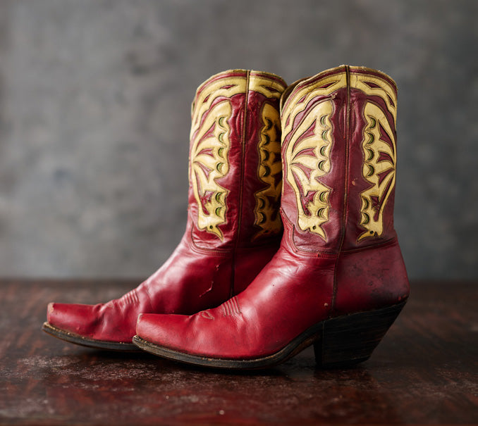 Red cowboy boots with contrasting shaft inlays, pictured in Western Horseman.